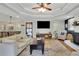 Bright and airy living room with hardwood floors, comfortable seating and a view to the dining area at 335 Brook Dr, Atlanta, GA 30328