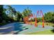 Red swing set with multiple arches in a park-like setting at 335 Brook Dr, Atlanta, GA 30328