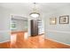 Dining area with hardwood floors and built-in shelving at 3373 Hogan Nw Dr, Kennesaw, GA 30152