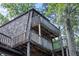 Elevated wooden deck wraps around home offering scenic views at 3200 Rim Cove Dr # 186, Cumming, GA 30041