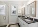Elegant bathroom with double vanity, large mirror, and a glass shower at 108 Cottage Gate Ln, Roswell, GA 30076