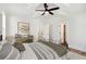 Bedroom with ceiling fan and access to bathroom at 108 Cottage Gate Ln, Roswell, GA 30076