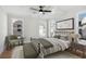 Spacious bedroom with ceiling fan and hardwood floors at 108 Cottage Gate Ln, Roswell, GA 30076