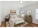 Spacious bedroom with wood floors, and neutral color palette at 108 Cottage Gate Ln, Roswell, GA 30076