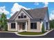 Craftsman style home with gray siding, a stone walkway, and a landscaped lawn at 108 Cottage Gate Ln, Roswell, GA 30076