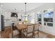 Modern kitchen with white cabinets, large island, and breakfast area at 108 Cottage Gate Ln, Roswell, GA 30076
