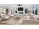 Spacious living room with fireplace, large windows, and comfortable seating at 108 Cottage Gate Ln, Roswell, GA 30076
