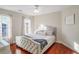 Spacious bedroom with hardwood floors and a large bed at 169 Blue Creek Ln, Loganville, GA 30052