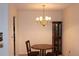 Dining room with chandelier, round table, and dark wood furniture at 300 Johnson Ferry Rd # B802, Atlanta, GA 30328