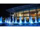 Water fountain lit up at night in front of a large building at 300 Johnson Ferry Rd # B802, Atlanta, GA 30328