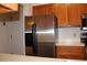 Modern kitchen with stainless steel refrigerator and wood cabinets at 300 Johnson Ferry Rd # B802, Atlanta, GA 30328