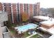 Community pool with lounge chairs and surrounding trees at 300 Johnson Ferry Rd # B802, Atlanta, GA 30328