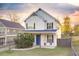 Two-story house with white siding, blue door, and a fenced yard at 1427 Bouldercrest Se Rd, Atlanta, GA 30316