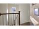 Upper hallway with chandelier and access to bedrooms at 1427 Bouldercrest Se Rd, Atlanta, GA 30316