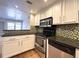 Well-equipped kitchen, featuring stainless steel appliances and granite countertops at 199 14Th Ne St # 1609, Atlanta, GA 30309