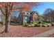 Two-story house with brick and siding, surrounded by autumn leaves at 1081 Bridgemill Ave, Canton, GA 30114