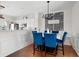 Bright dining area with blue chairs and a marble table, hardwood floors at 1381 Dolcetto Nw Trce # 9, Kennesaw, GA 30152