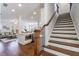 Elegant wooden staircase with wrought iron railing at 5260 Cresslyn Rdg, Alpharetta, GA 30005