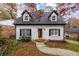 Charming white brick home with black trim and a welcoming walkway at 1957 Lebanon Ne Dr, Atlanta, GA 30324