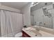 Clean bathroom with a shower/tub combo and updated vanity at 2075 Pine Tree Dr # A4, Buford, GA 30518