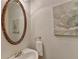 Charming bathroom with an oval mirror and decorative artwork at 2075 Pine Tree Dr # A4, Buford, GA 30518