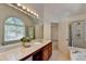 Bathroom with double sinks, garden tub, and separate shower at 2075 Pine Tree Dr # A4, Buford, GA 30518