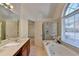 Bathroom features a shower/tub combo and an updated vanity at 2075 Pine Tree Dr # A4, Buford, GA 30518