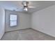 Well-lit bedroom featuring a ceiling fan and carpet at 2075 Pine Tree Dr # A4, Buford, GA 30518