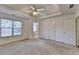Bright and airy bedroom with carpet flooring and access to bathroom at 2075 Pine Tree Dr # A4, Buford, GA 30518