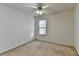 Spacious bedroom with ceiling fan and neutral carpeting at 2075 Pine Tree Dr # A4, Buford, GA 30518