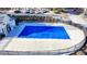 Community pool with blue cover and surrounding fence at 2075 Pine Tree Dr # A4, Buford, GA 30518