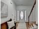 Bright and airy entryway with hardwood floors and bench at 2075 Pine Tree Dr # A4, Buford, GA 30518