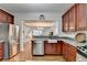 Open concept kitchen with stainless steel appliances and island at 2075 Pine Tree Dr # A4, Buford, GA 30518