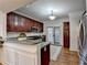 Kitchen features stainless steel appliances and dark wood cabinets at 2075 Pine Tree Dr # A4, Buford, GA 30518