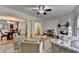 Open living room with hardwood floors, fireplace, and view to dining area at 2075 Pine Tree Dr # A4, Buford, GA 30518
