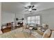 Spacious living room with fireplace, hardwood floors, and large windows at 2075 Pine Tree Dr # A4, Buford, GA 30518