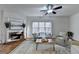 Spacious living room with fireplace, hardwood floors, and large windows at 2075 Pine Tree Dr # A4, Buford, GA 30518