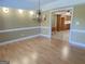 Formal dining room offering a view into the kitchen at 3550 Bay Creek Church Rd, Loganville, GA 30052