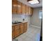 Laundry room with double sink and wood cabinets at 3550 Bay Creek Church Rd, Loganville, GA 30052