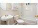 Clean bathroom with white tub, sink, and toilet at 12175 Clairmeade Trl, Alpharetta, GA 30009