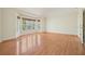 Spacious bedroom featuring hardwood floors and large windows at 12175 Clairmeade Trl, Alpharetta, GA 30009