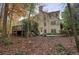 Two-story house exterior with deck and surrounding trees at 12175 Clairmeade Trl, Alpharetta, GA 30009