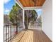 Wooden deck balcony overlooking the street with a wooden ceiling at 984 Mcdaniel Sw St, Atlanta, GA 30310