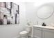 Modern powder room with gray vanity and stylish artwork at 984 Mcdaniel Sw St, Atlanta, GA 30310