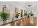 Bright sunroom with hardwood floors and abundant natural light from numerous windows at 3775 Belle Glade Trl, Snellville, GA 30039