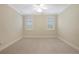 Bright and airy bedroom with carpet flooring and large windows at 1314 Ponce De Leon Ne Ave, Atlanta, GA 30306