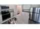 Modern kitchen with stainless steel appliances and granite countertops at 7542 Saffron Ave, Covington, GA 30014