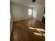 Bright bedroom featuring light wood-look flooring at 1777 Cahoon Sw St, Atlanta, GA 30310