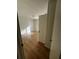 Simple bedroom with light wood-look flooring and a window at 1777 Cahoon Sw St, Atlanta, GA 30310