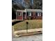 Brick ranch house with a well-maintained lawn and a black mailbox at 1777 Cahoon Sw St, Atlanta, GA 30310